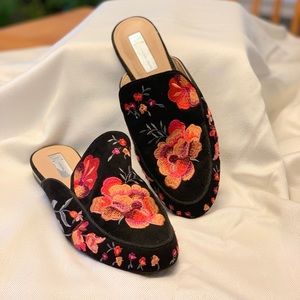 Embroidered floral mule.